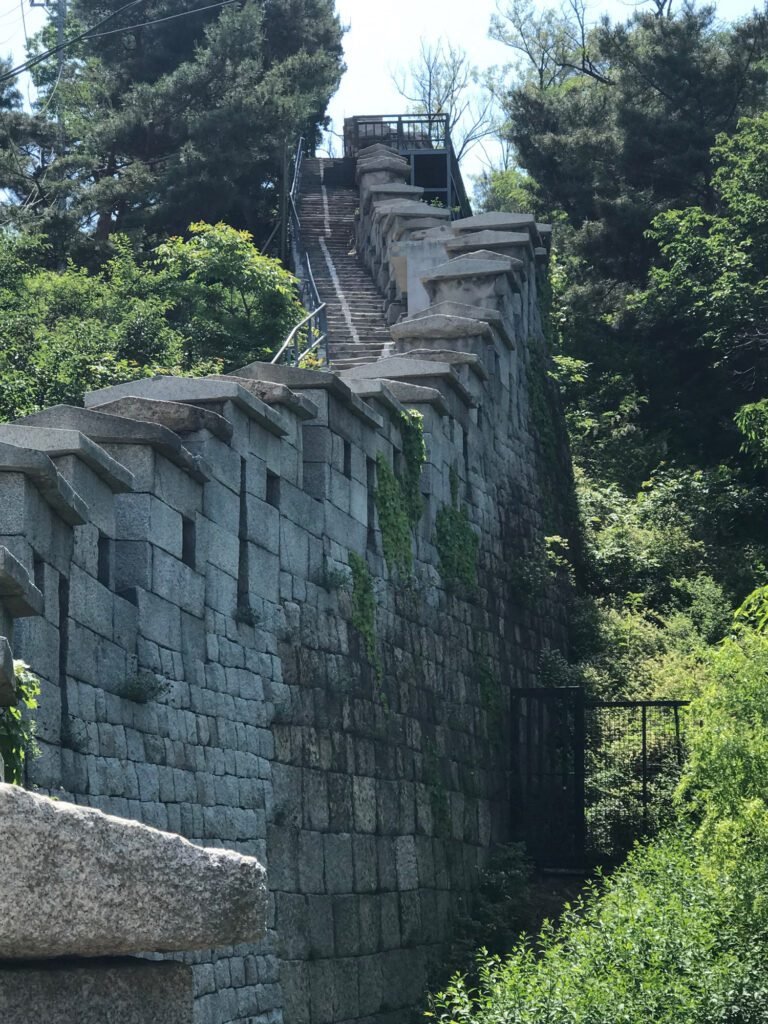 The fortress wall on Mount Ingwansan - Seoul. Solo travel for women over 50.