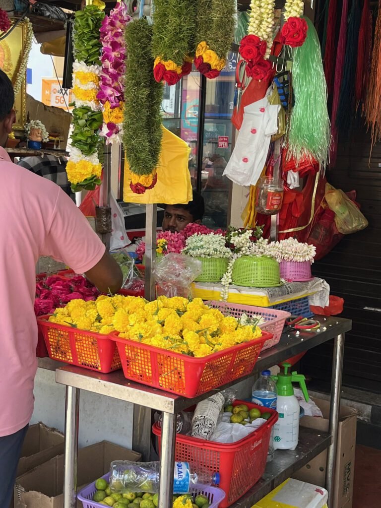 Garlands of marigolds, roses, and jasmine for sale in Little India — often used as offerings to Hindu deities and for festival occasions such as Deepavali.