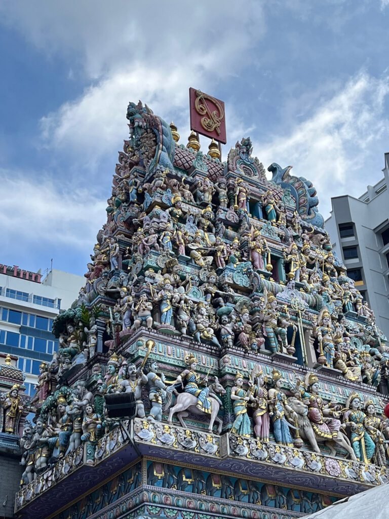 Intricate statues adorn the Sri Veeramakaliamman Hindu Temple in Little India, Singapore.