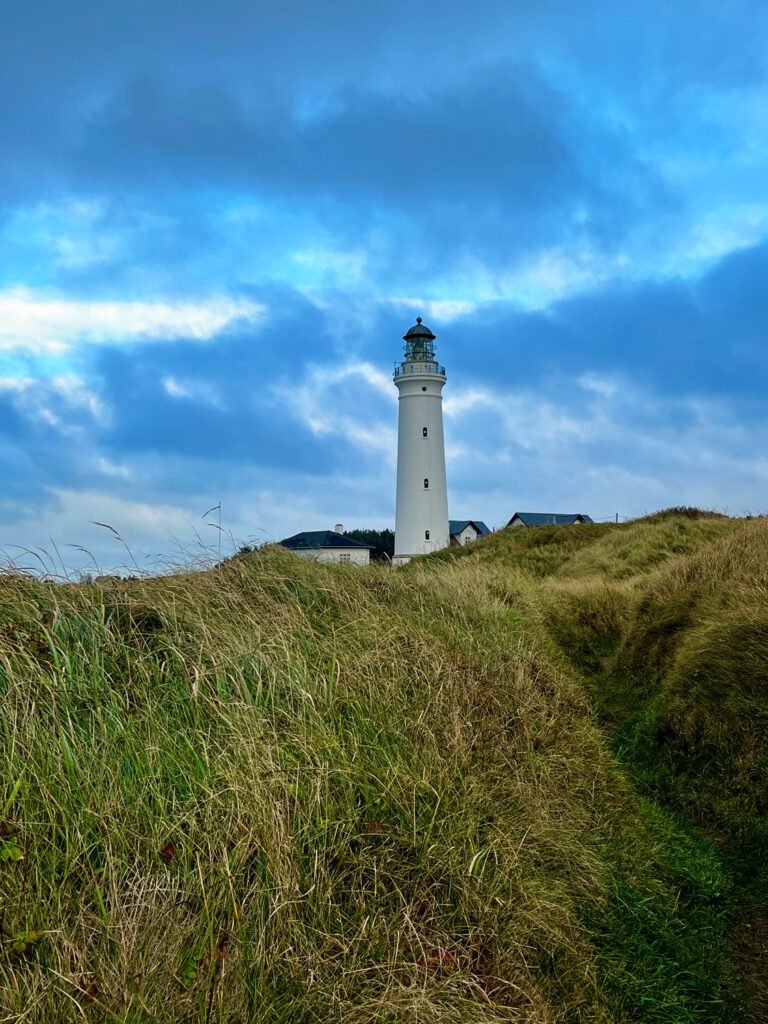 Hirtshals Lighthouse stands as a sentinel above the sand dunes.