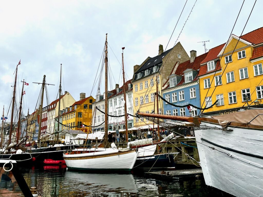 Nyhavn in Copenhagen may be famous but it's also beautiful – take a canal cruise, enjoy some street food, or sit down for a full meal. 48 hours in Copenhagen.